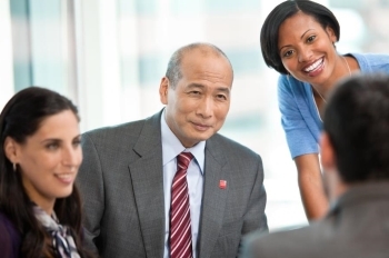 financial advisor team consulting with client